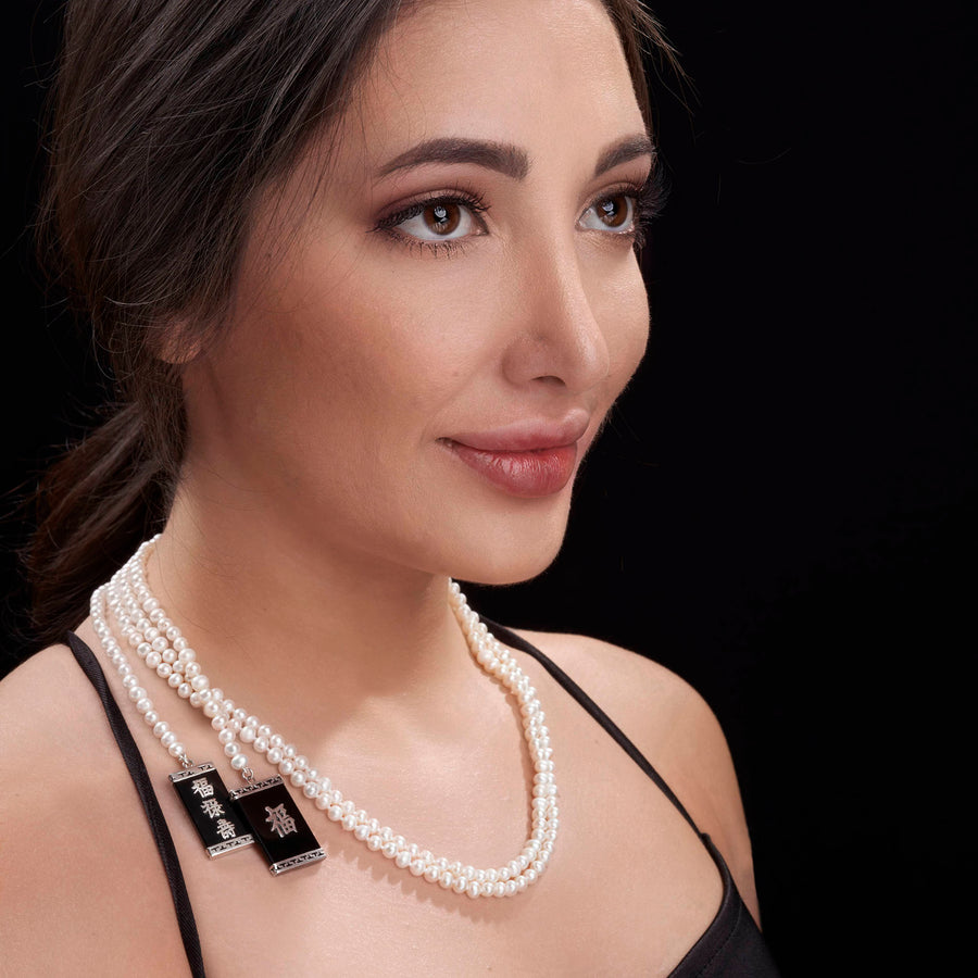 woman wearing White pearl necklace